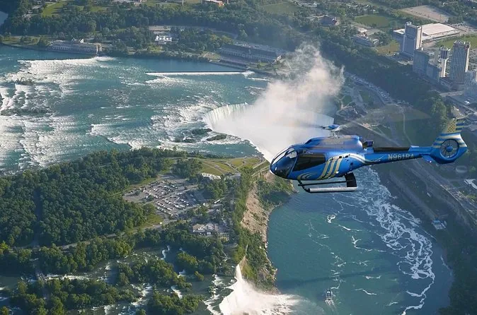A tour helicopter flying beside the Horseshoe Falls