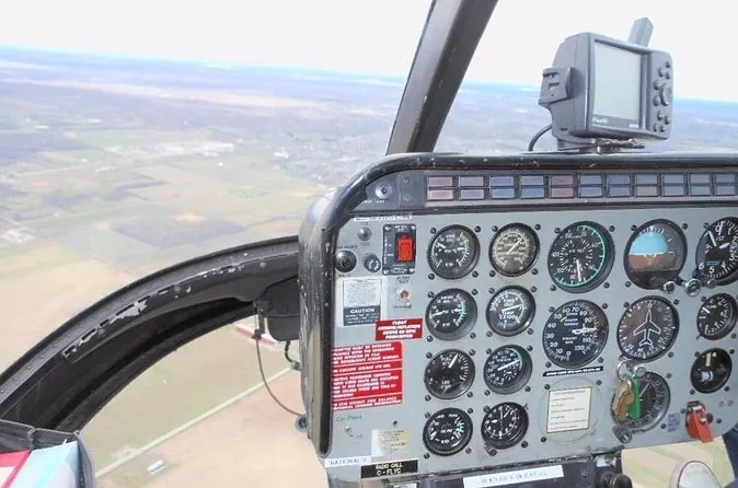 Cockpit instruments with the landscape outside